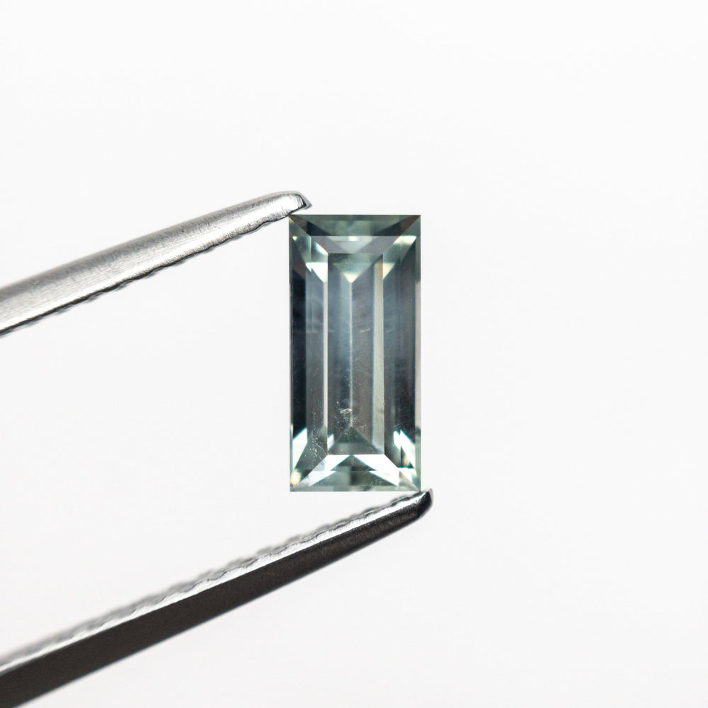 
            
                Load image into Gallery viewer, 0.97ct 7.30x3.51x3.21mm Baguette Step Cut Sapphire 24172-02
            
        